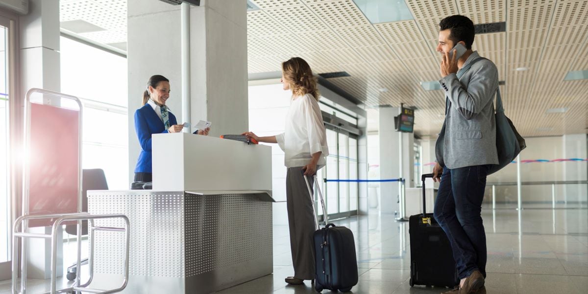 travelers at airport in line