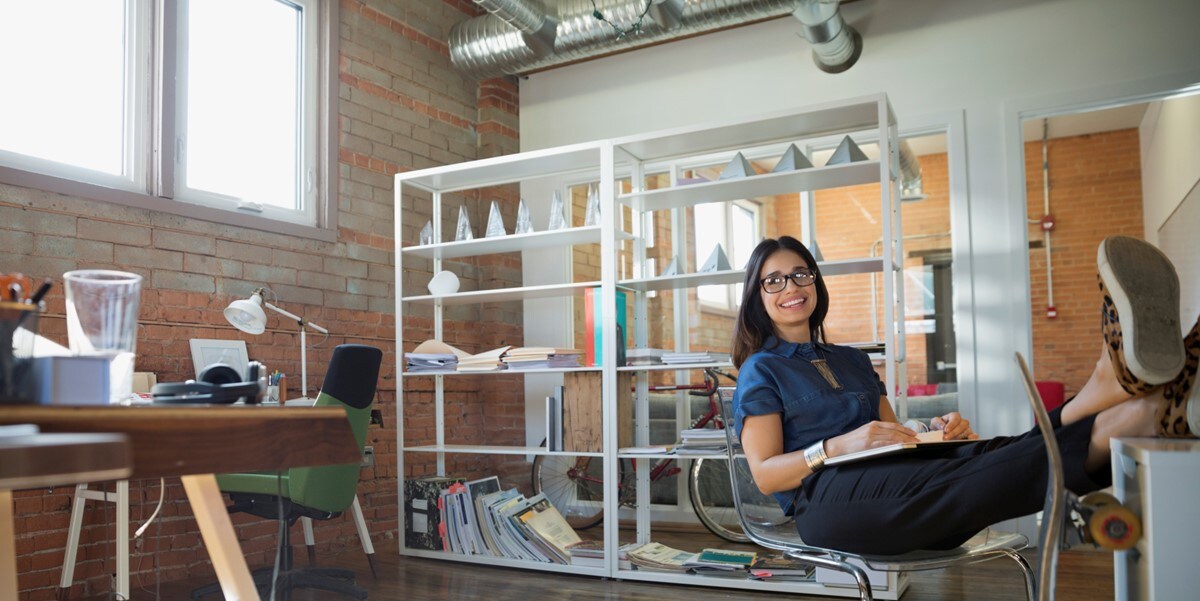 woman in office with feet up on desk