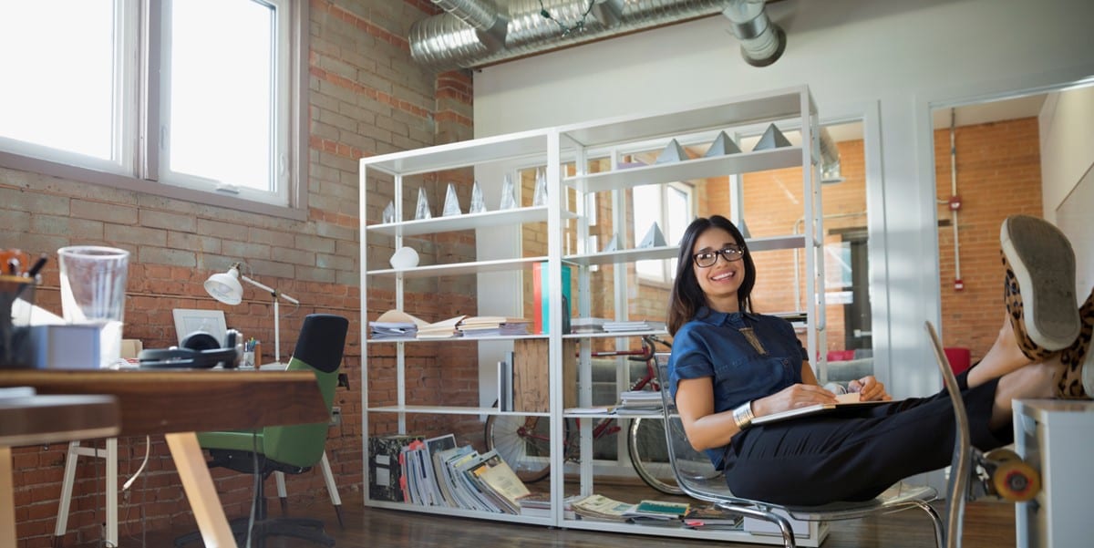 woman in office with feet up on desk