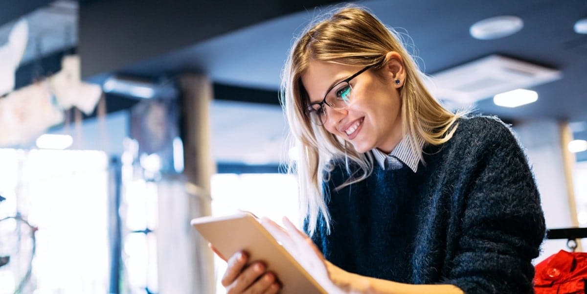 professional woman in office reading a document