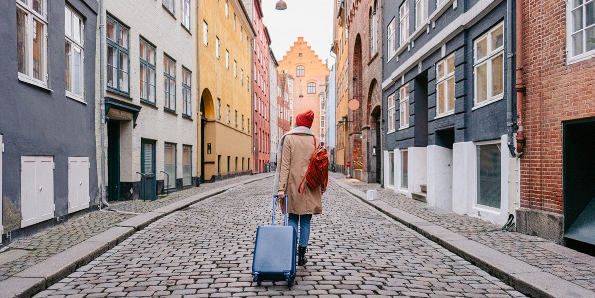 traveler in city with luggage